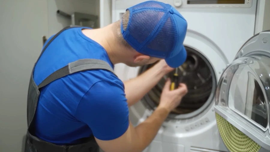 Certified technician repairing a washing machine in Abilene TX